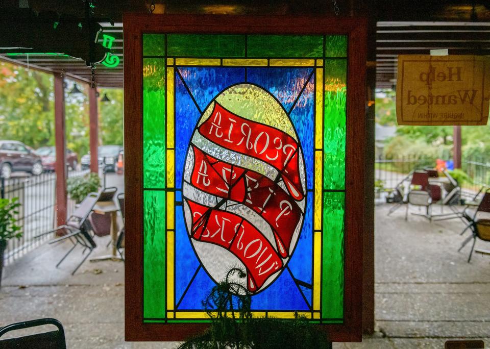 Stained glass windows hang in Peoria Pizza Works at 3921 N. Prospect Road in Peoria Heights.