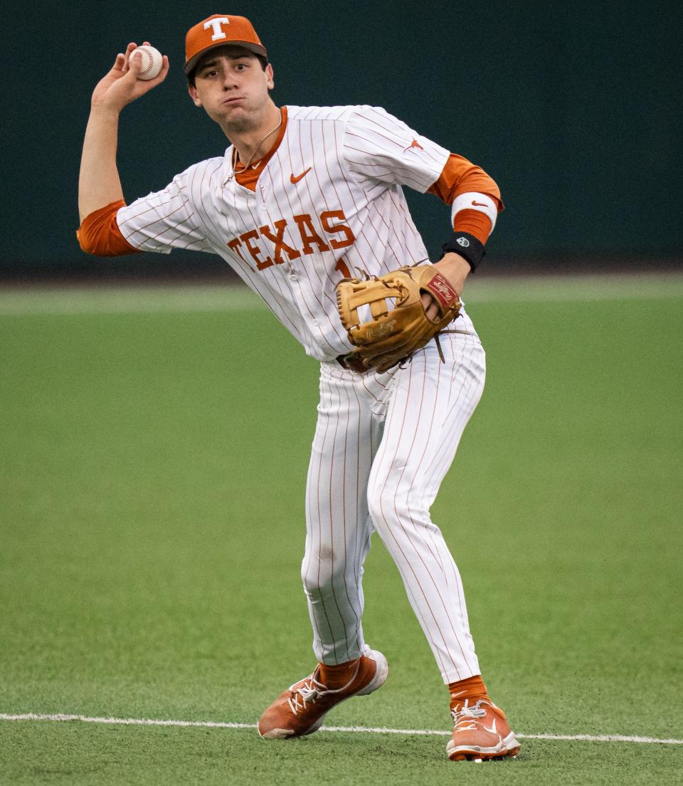 Texas shortstop Jalin Flores throws the ball to first base during last Thursday's win over Kansas at UFCU Disch-Falk Field.