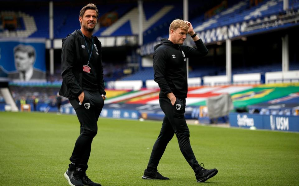 Bournemouth manager Eddie Howe (right) and assistant manager Jason Tindall walk the pitch prior to the Premier League match  - PA