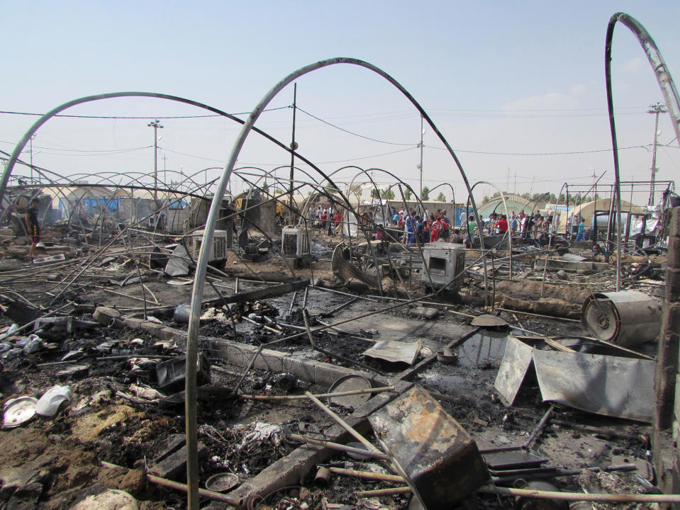 Tents destroyed by fire at a refugee camp near Kirkuk, Iraq