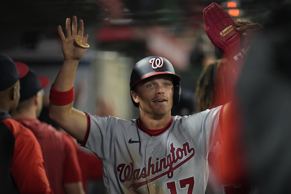 Washington Nationals' Alex Call celebrates after scoring off of a single hit by Jeimer Candelario during the fourth inning of a baseball game against the Los Angeles Angels in Anaheim, Calif., Monday, April 10, 2023. Lane Thomas also scored. (AP Photo/Ashley Landis)