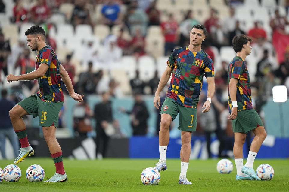 Portugal's Cristiano Ronaldo warms up prior the start of the World Cup round of 16 soccer match between Portugal and Switzerland, at the Lusail Stadium in Lusail, Qatar, on Tuesday, Dec. 6, 2022. (AP Photo/Pavel Golovkin)