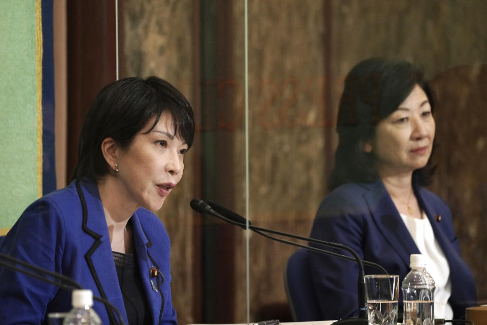 FILE - In this Sept. 18, 2021, file photo, Sanae Takaichi, left, and Seiko Noda, both former internal affairs ministers and candidates for the presidential election of the ruling Liberal Democratic Party, attend a debate session held by Japan National Press club in Tokyo. The stakes are high as Japanese governing party members vote Wednesday, Sept. 29, 2021 for four candidates seeking to replace Yoshihide Suga as prime minister. The next leader must address a pandemic-battered economy, a newly empowered military operating in a dangerous neighborhood, crucial ties with an inward-focused ally, Washington, and tense security standoffs with an emboldened China and its ally North Korea. (AP Photo/Eugene Hoshiko, Pool, File)