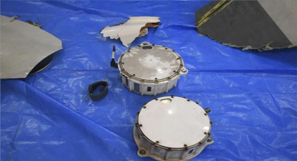 This image released by Japan Maritime Self-Defense Force shows the retrieved components which are believed to be a part of a crashed helicopter, Sunday, April 21, 2024. Initial analysis of flight data recorders recovered from the waters in the Pacific near the crash site of the two Japanese navy helicopters showed no sign that mechanical problems in the aircraft caused the accident, Japan’s defense minister said Monday, as he indicated human error. (Japan Maritime Self-Defense Force via AP)