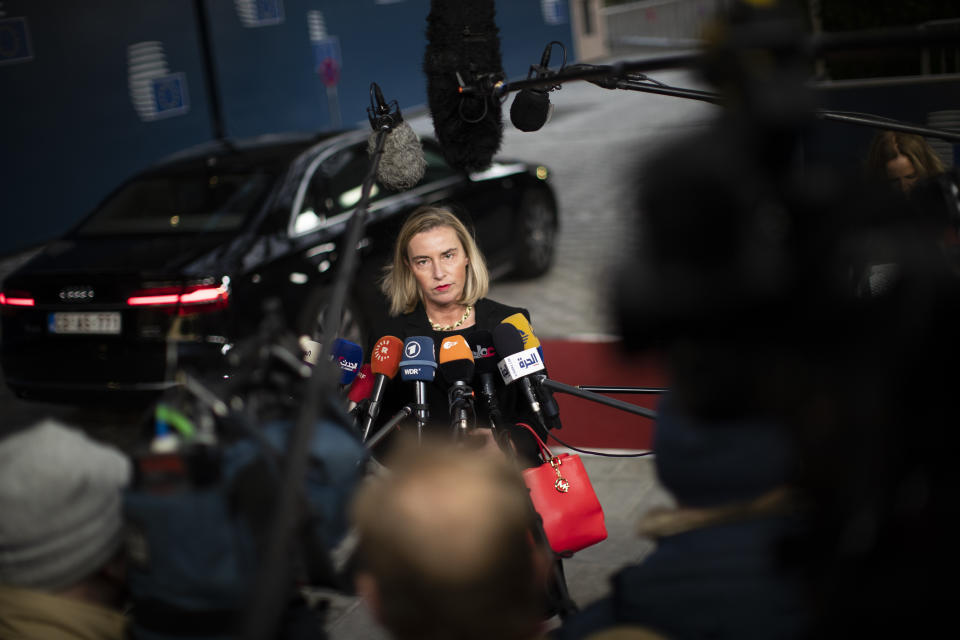 European Union Foreign Policy chief Federica Mogherini talks to journalists as she arrives to an European Foreign Affairs Ministers meeting at the Europa building in Brussels, Monday, Nov. 11, 2019. European Union foreign ministers are discussing ways to keep the Iran nuclear deal intact after the Islamic Republic began enrichment work at its Fordo power plant. (AP Photo/Francisco Seco)