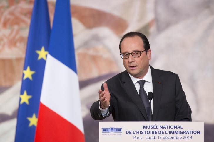 French President Francois Hollande delivers his speech as he attends the inauguration of the National Centre on the History of Immigration in Paris December 15, 2014. REUTERS/Yoan Valat/Pool