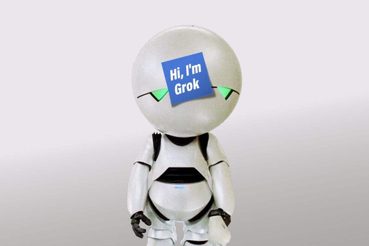 Marvin the Paranoid Android with a "Hi, I'm Grok" Post-It note affixed to his head.