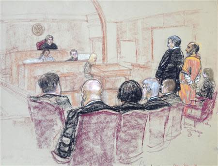 Babar Ahmad (in orange), a British national accused of operating a website that promoted jihad and supported al Qaeda, is pictured as he pleads guilty in this courtroom sketch in the U.S. District Court in New Haven, Connecticut December 10, 2013. REUTERS/Janet Hamlin