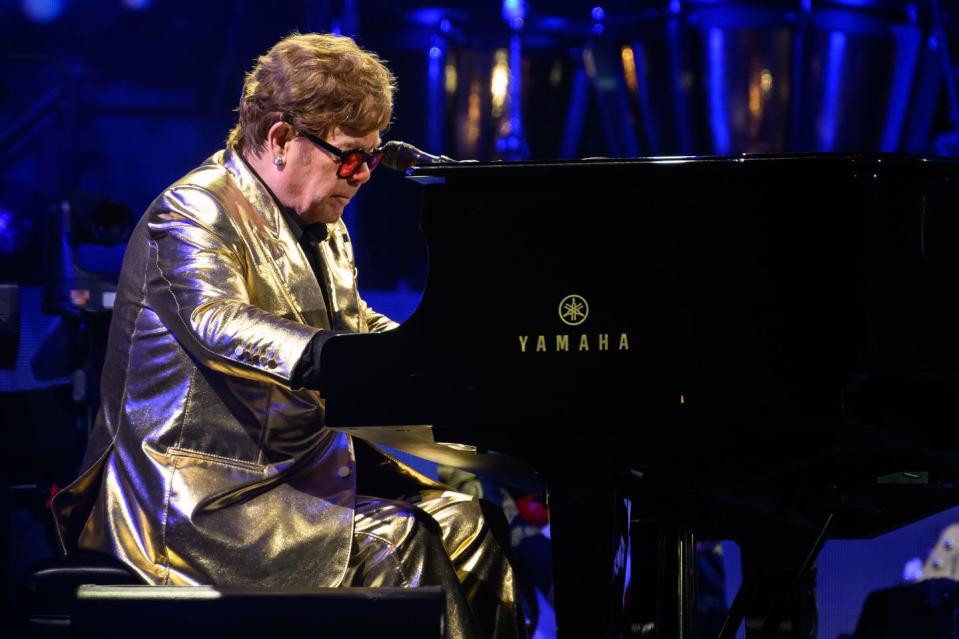 elton john plays his piano at glastonbury 2023