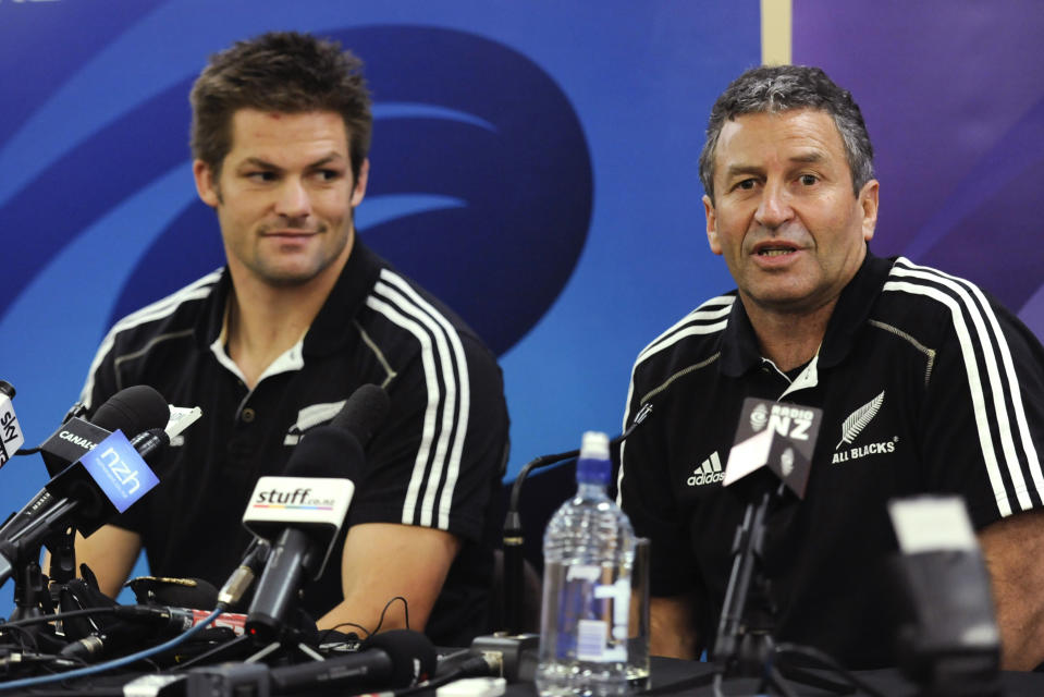 FILE - New Zealand All Blacks assistant coach Wayne Smith, right, answers a question as captain Richie McCaw, left, looks on during a press conference in Auckland, New Zealand, Oct. 22, 2011. Women's World Cup-winning coach Smith received a knighthood, Monday, June 5, 2023, for services to rugby in New Zealand's annual King's birthday honors. (AP Photo/Ross Land, File)