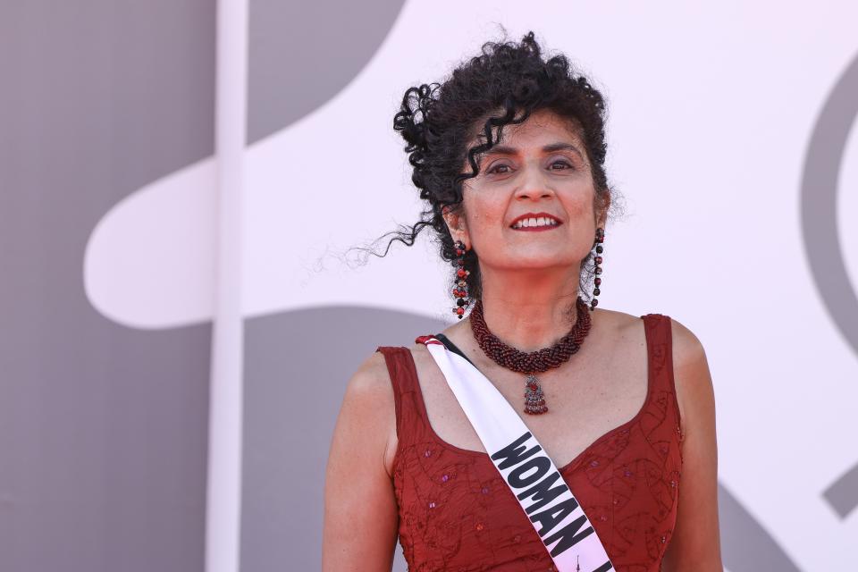 Behi Djanati wears a sash that reads 'Woman Life Freedom' as she poses for photographers upon arrival for the premiere of the film 'Green Border' during the 80th edition of the Venice Film Festival in Venice, Italy, on Tuesday, Sept. 5, 2023. (Photo by Vianney Le Caer/Invision/AP)