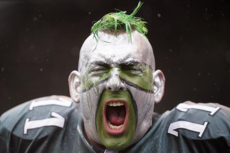 A Philadelphia Eagles fan cheers during the first half of an NFL football game between the Eagles and the Jacksonville Jaguars on Sunday, Oct. 2, 2022, in Philadelphia. (AP Photo/Matt Rourke)