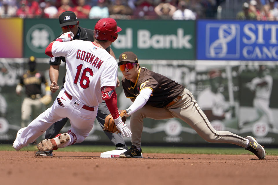 San Diego Padres shortstop Ha-Seong Kim, right, prepares to tag out St. Louis Cardinals' Nolan Gorman at second during the first inning of a baseball game Monday, May 30, 2022, in St. Louis. (AP Photo/Jeff Roberson)