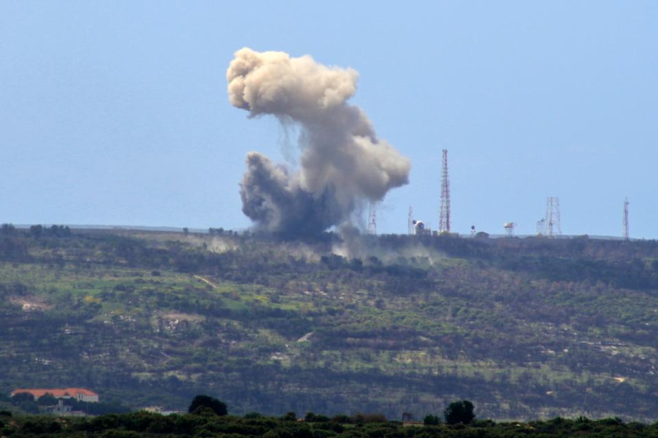 A picture taken from the southern Lebanese village of Alma al-Shaab shows smoke rising from an Israeli outpost after a rocket attack by Lebanon's Hezbollah on April 6, 2024.