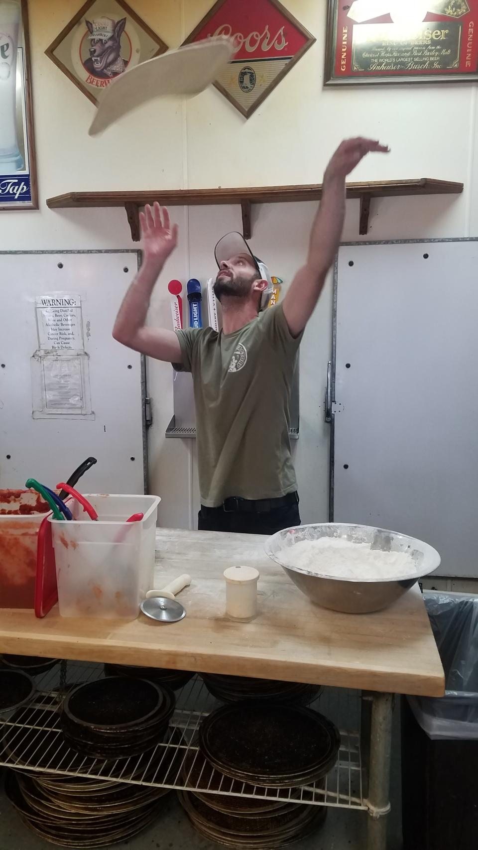 Vince Lombardi catches the crust for an extra large pizza at the Pizza Factory in Phelan.