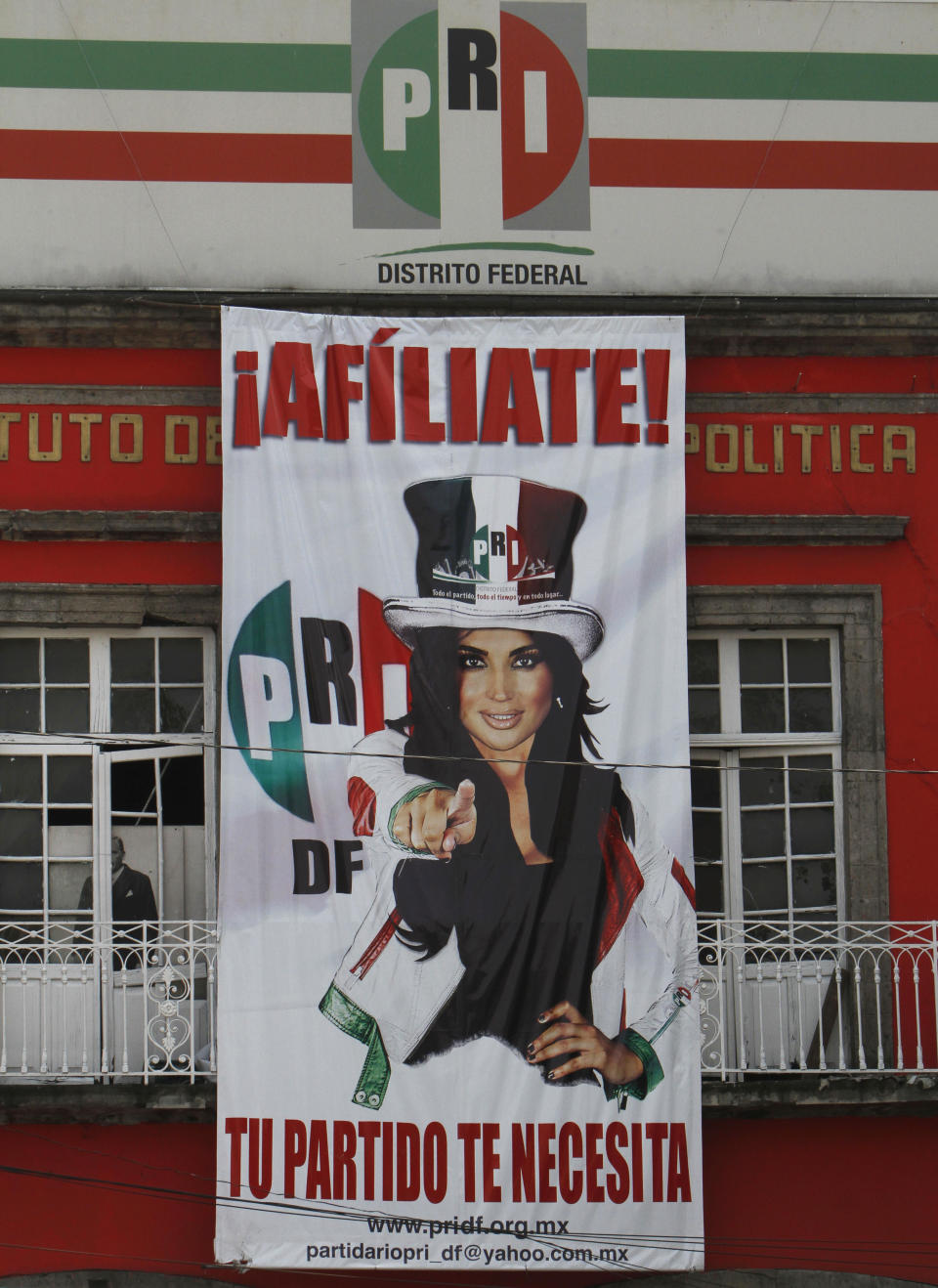 A sign promoting the Institutional Revolutionary Party (PRI) reads in Spanish "Sign up! Your party needs you." outside a PRI office used for political training in Mexico City, Wednesday, April 2, 2014. Cuauhtemoc Gutierrez, local political chief from Mexico's ruling party, the PRI, is denying local press reports that his office hired women to have sex with him by placing them on party payrolls as secretaries or receptionists. (AP Photo/Marco Ugarte)