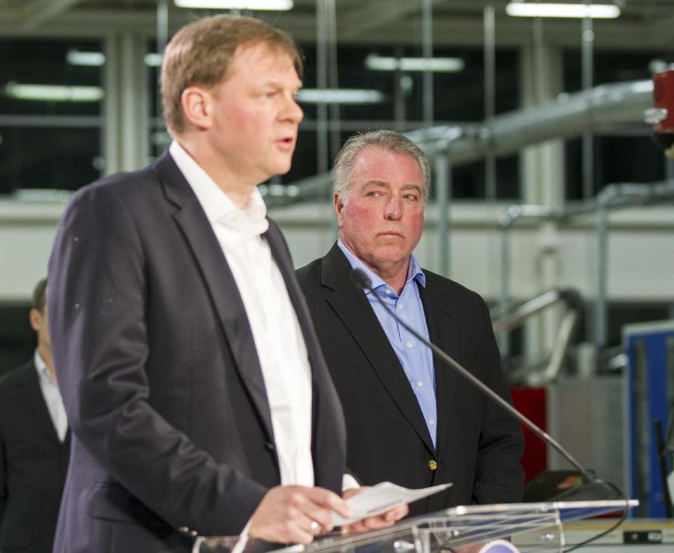 Gary Casteel, right, a regional director for the United Auto Workers, stands near as Frank Fischer, the chairman and CEO of the Volkswagen plant in Chattanooga, Tenn., discusses workers' vote against union representation on Friday, Feb. 14, 2014. The 712 to 626 vote is a devastating blow to the union and its efforts to organize other Southern plants run by foreign automakers. (AP Photo/Erik Schelzig)