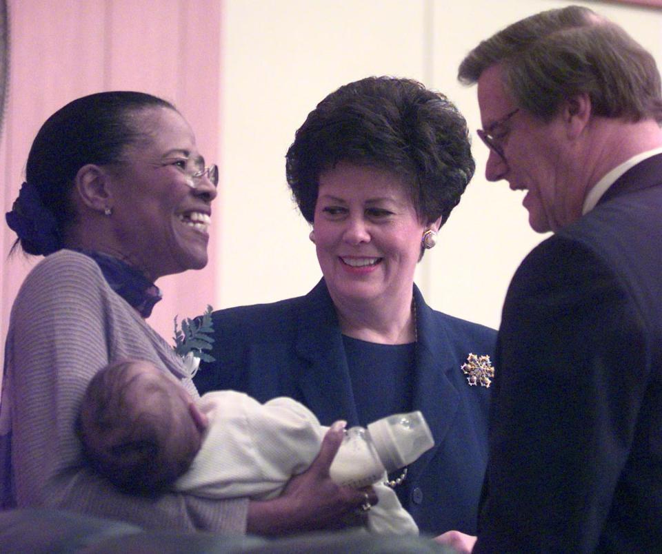 In this 1999 photo, then-state Sen. Betty Holzendorf, left, shows off her 4-month-old grandson, Kevin, to House Speaker John Thrasher, right, and Senate President Toni Jennings before Gov. Jeb Bush's annual state of the state address..