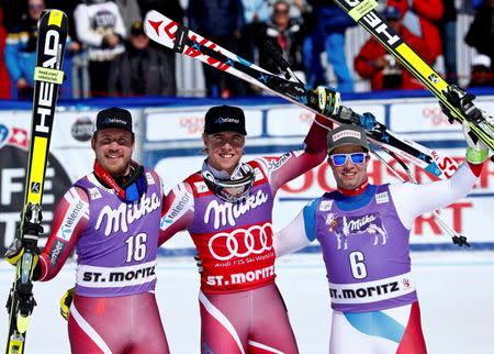 Alpine Skiing - Alpine Skiing World Cup - Men's Super-G race - St. Moritz, Switzerland - 17/3/16 - Kjetil Jansrud of Norway, Aleksander Aamodt Kilde of Norway and Beat Feuz of Switzerland react REUTERS/Arnd Wiegmann