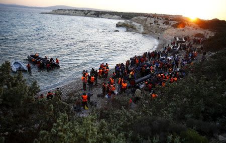 Refugees gather at a beach to try to sail off for the Greek island of Chios from the western Turkish coastal town of Cesme, in Izmir province, Turkey in this November 4, 2015 file photo. REUTERS/Umit Bektas/Files