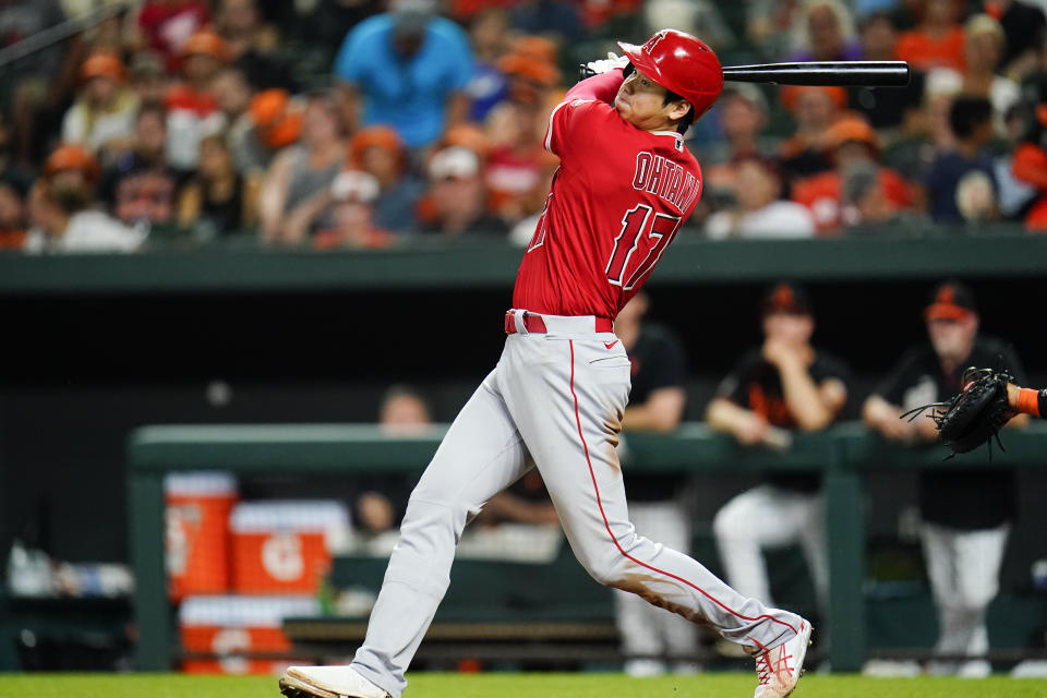 Los Angeles Angels' Shohei Ohtani singles against the Baltimore Orioles during the seventh inning of a baseball game, Friday, July 8, 2022, in Baltimore. (AP Photo/Julio Cortez)