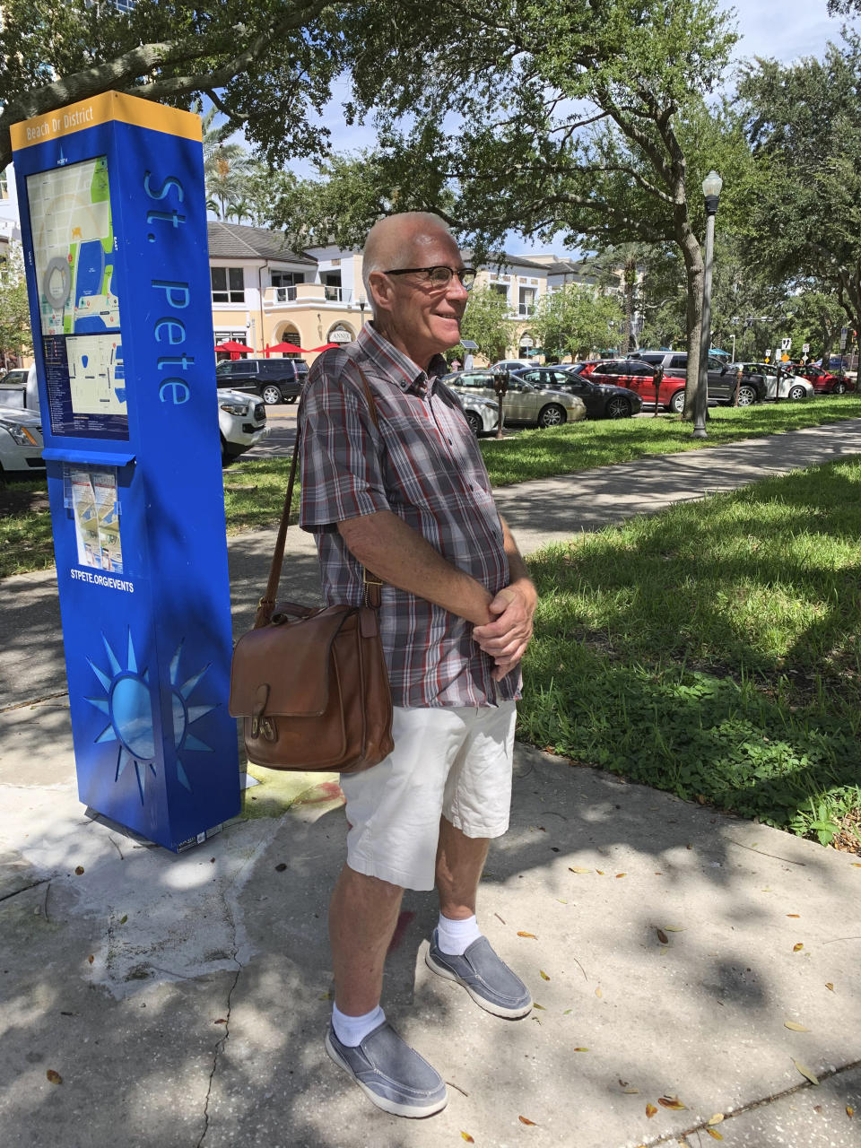 Raymond Holmes takes his daily walk, Wednesday, Sept. 23, 2020, in St. Petersburg, Fla. Trump recently said that COVID-19 was seriously affecting “virtually nobody” under the age of 18 and sought to frame the pandemic as largely impacting older Americans, as he argued for school districts to resume in-person learning. Holmes is a Trump supporter who defends the president’s remarks about older people and the coronavirus. (AP Photo/Tamara Lush)