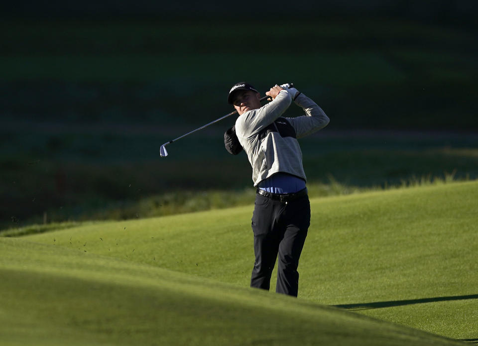Justin Thomas watches his second shot from the eighth fairway as second round play continues during the Genesis Open golf tournament at Riviera Country Club on Saturday, Feb. 16, 2019, in the Pacific Palisades area of Los Angeles. (AP Photo/Ryan Kang)