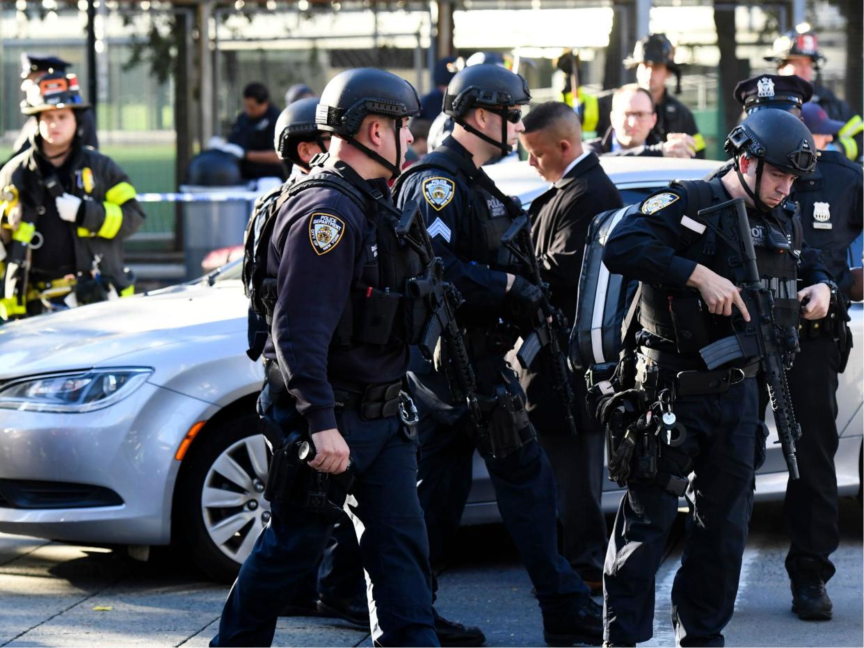 Police officers arrive at the scene following the attack in New York on 31 October 2017: DON EMMERT/AFP/Getty Images