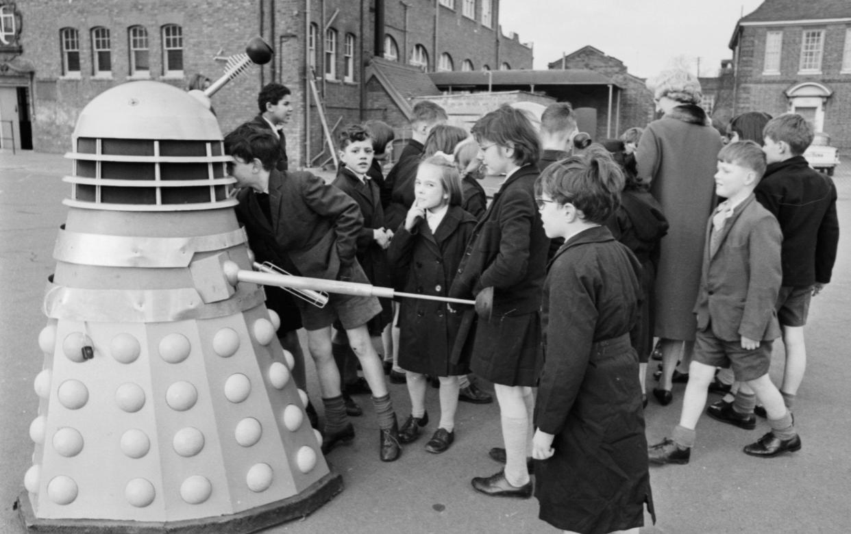 Children from Barnardo's greet a donated Dalek in February 1964 - M McKeown/Express/Getty
