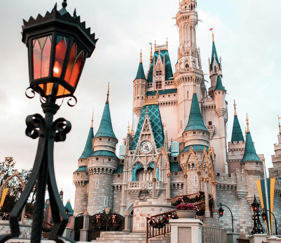 Learn more about why Disney is making changes to its DAS program, Pictured: the Disney castle on a bright clear day