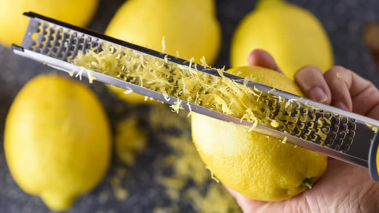 zesting lemons on microplaner