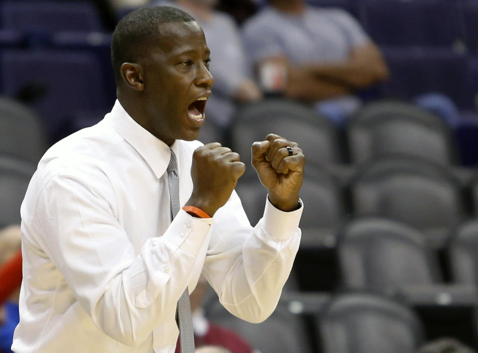 FILE - In this Dec. 8, 2019, file photo, Dayton head coach Anthony Grant calls out from the bench during the second half of an NCAA college basketball game against Saint Mary's in Phoenix. Grant was named AP coach of the year, Tuesday, March 24, 2020. (AP Photo/Ralph Freso, File)