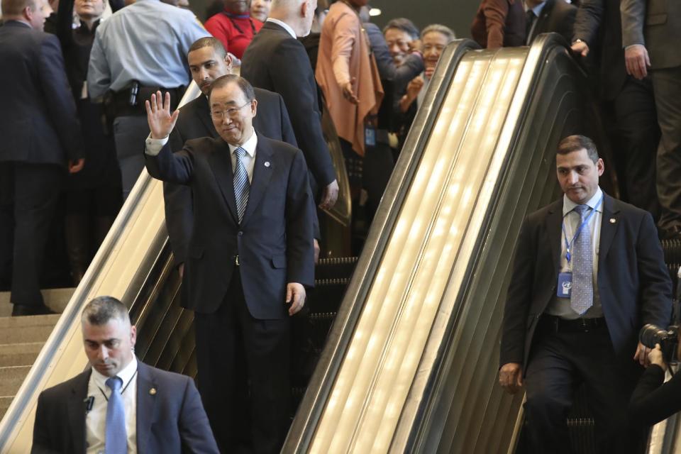 United Nations Secretary-General Ban Ki-moon waves to his staff as he leaves on his last day at the U.N. headquarters, Friday, Dec. 30, 2016. (AP Photo/Mary Altaffer)