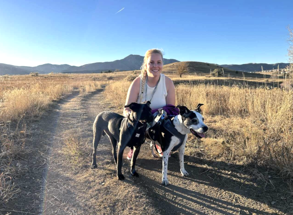 Truck driver Elizabeth Sanborn, 35, poses with her dogs, Porscha and Buttercup. (Photo: Elizabeth Sanborn)