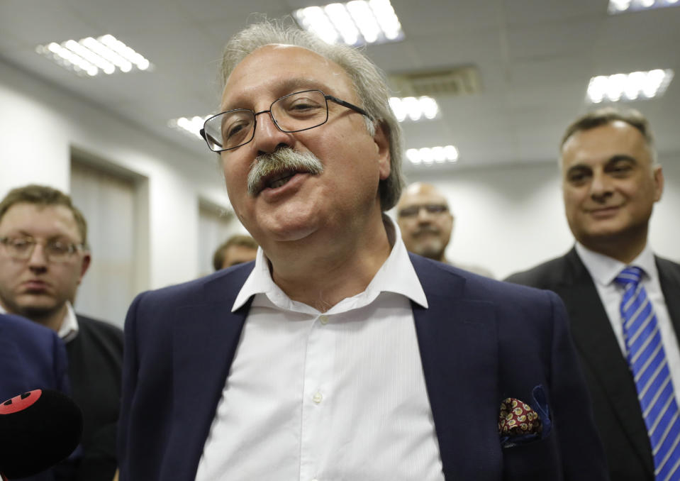 Grigol Vashadze, Georgia's former foreign minister and presidential candidate, reacts at his campaign headquarter following the presidential election in Tbilisi, Georgia, Wednesday, Nov. 28, 2018. Two of Georgia's former foreign ministers are facing off against each other Wednesday in a tight runoff that will mark the last time Georgians elect their head of state by popular vote. (AP Photo/Shakh Aivazov)