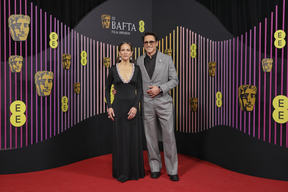 Susan Downey, left, and Robert Downey Jr. pose for photographers upon arrival at the 77th British Academy Film Awards, BAFTA's, in London, Sunday, Feb. 18, 2024. (Photo by Vianney Le Caer/Invision/AP)