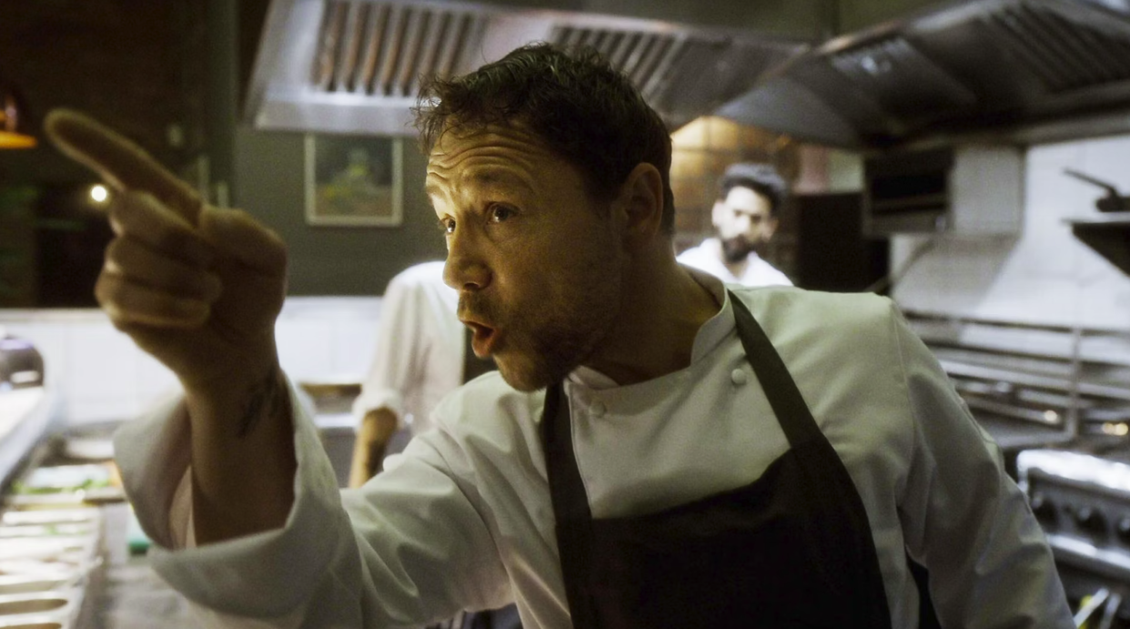  Boiling Point's head chef (Stephen Graham) points his finger angrily in a busy kitchen. 