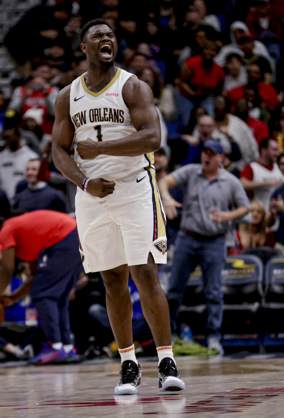 New Orleans Pelicans forward Zion Williamson (1) reacts after scoring against the Houston Rockets during the first half of an NBA basketball game in New Orleans, Thursday, Feb. 22, 2024. (AP Photo/Derick Hingle)