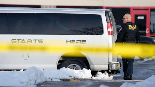 PHOTO: A law enforcement officer walks outside the Starts Right Here building, Jan. 23, 2023, in Des Moines, Iowa. Police say two students were killed and a teacher was injured in a shooting at the Des Moines school on the edge of the city's downtown. (Charlie Neibergall/AP)