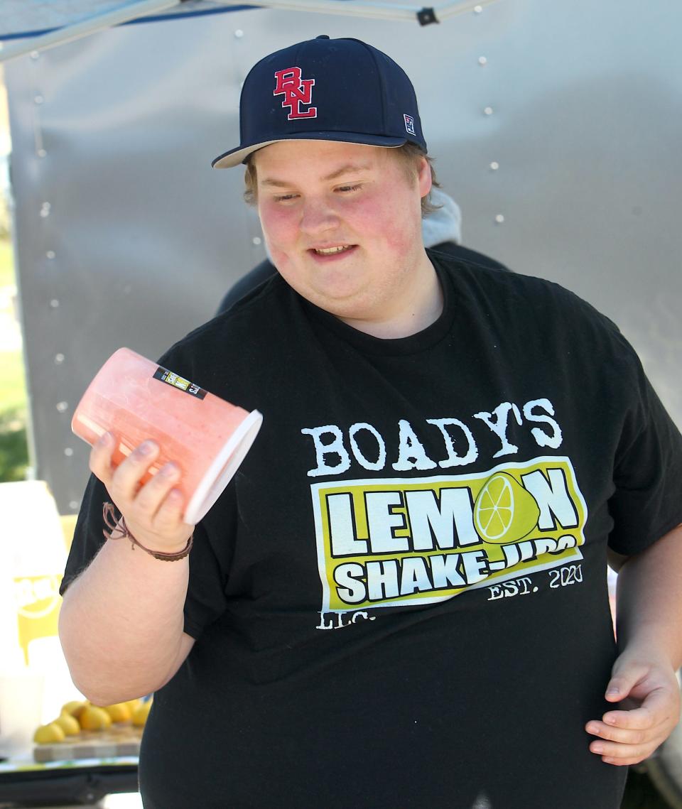 Carson Boady makes a shake up for a customer on Saturday, April 6, 2024, during the Eclipse Over Lawrence County celebration.