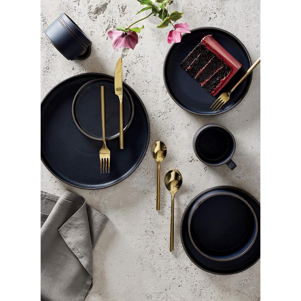 <p>CB2 20-Piece Rush Brushed Gold Flatware Set</p><p>cb2.com</p><p>$99.95</p><p><a href="https://go.redirectingat.com?id=74968X1596630&url=https%3A%2F%2Fwww.cb2.com%2F20-piece-rush-gold-flatware-set%2Fs509405&sref=https%3A%2F%2Fwww.cosmopolitan.com%2Flifestyle%2Fa42242914%2Fholiday-place-settings%2F" rel="nofollow noopener" target="_blank" data-ylk="slk:Shop Now;elm:context_link;itc:0;sec:content-canvas" class="link ">Shop Now</a></p><span class="copyright">CB2</span>