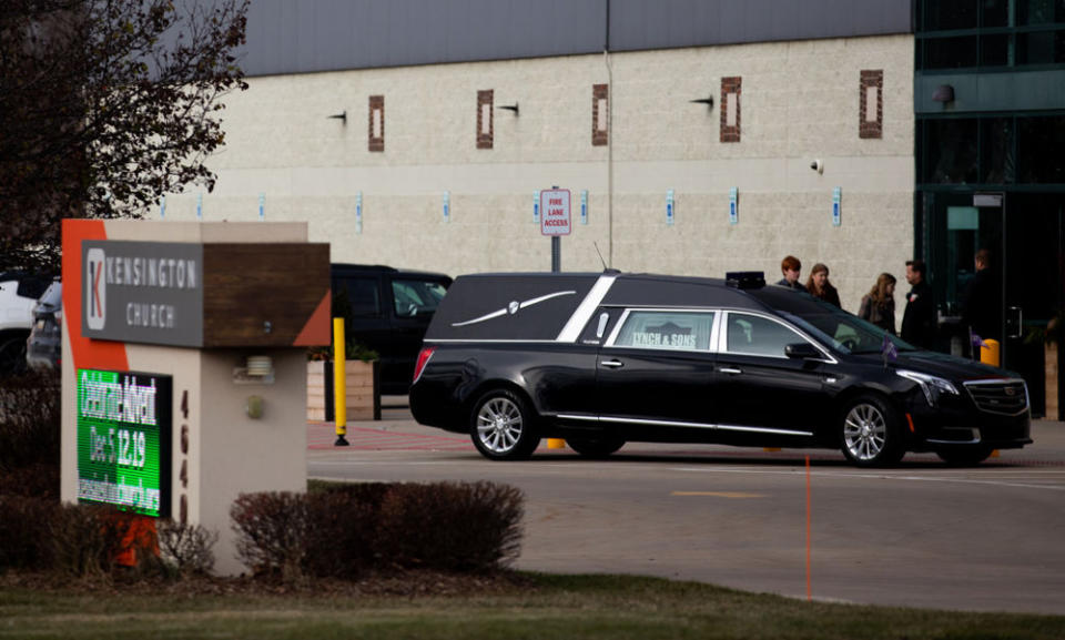 A hearse is seen parked outside Kensington Church as people arrive for the funeral of Oxford High School shooting victim Tate Myres. Also killed in the shooting were Madisyn Baldwin, Justin Shilling and Hana St. Juliana. (Emily Elconin/Getty Images)