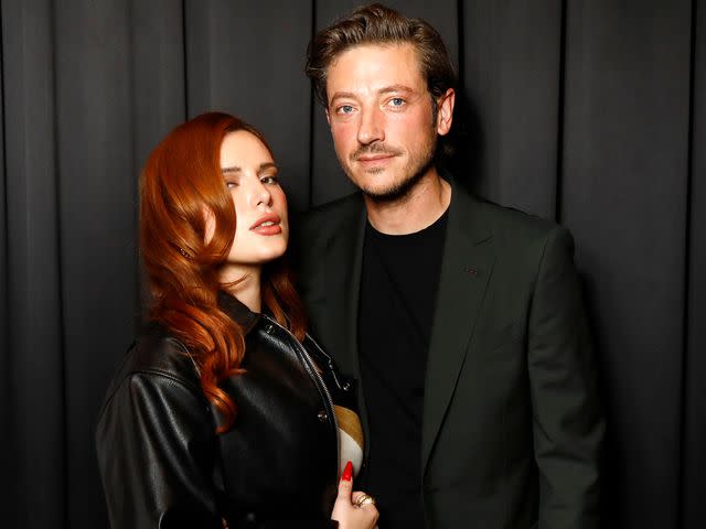 <p>Julien M. Hekimian/Getty</p> Bella Thorne and Mark Emms attend the amfAR Paris Fashion Week Cocktail Party at Sinner Paris on October 01, 2023 in Paris, France.