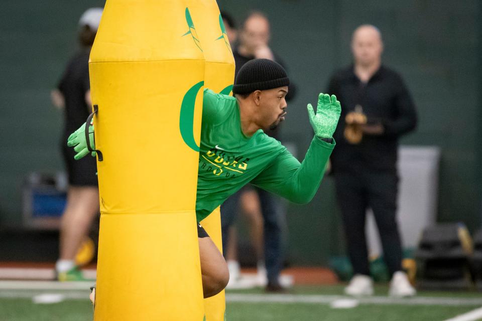 Oregon defensive tackle Taki Taimani participates in drills during Oregon Pro Day Tuesday, March 12, 2024 at the Moshofsky Center in Eugene, Ore.