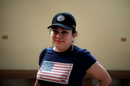 Emily Hernandez poses for a photograph before a ceremony to welcome Washington D.C. mayor Muriel Bowser in Intipuca, El Salvador, August 14, 2018. REUTERS/Jose Cabezas