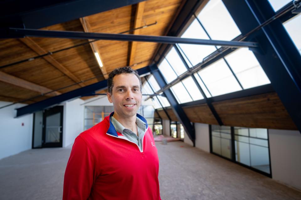 Randy Reichardt, owner of 515 28th St. in Des Moines, under the signature skylight in the building's event space. It also houses the Chain & Spoke bike and coffee shop, and there's room for restaurants.
