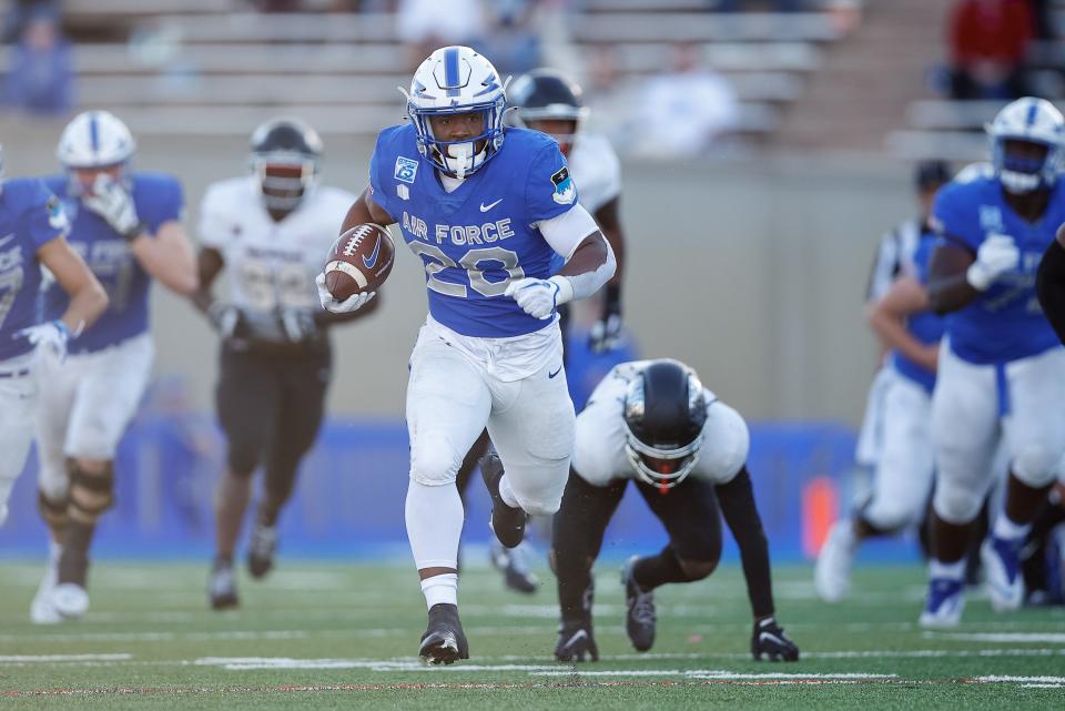 Air Force fullback Emmanuel Michel (28) runs away from the UNLV defense, which is what Air Force does best.