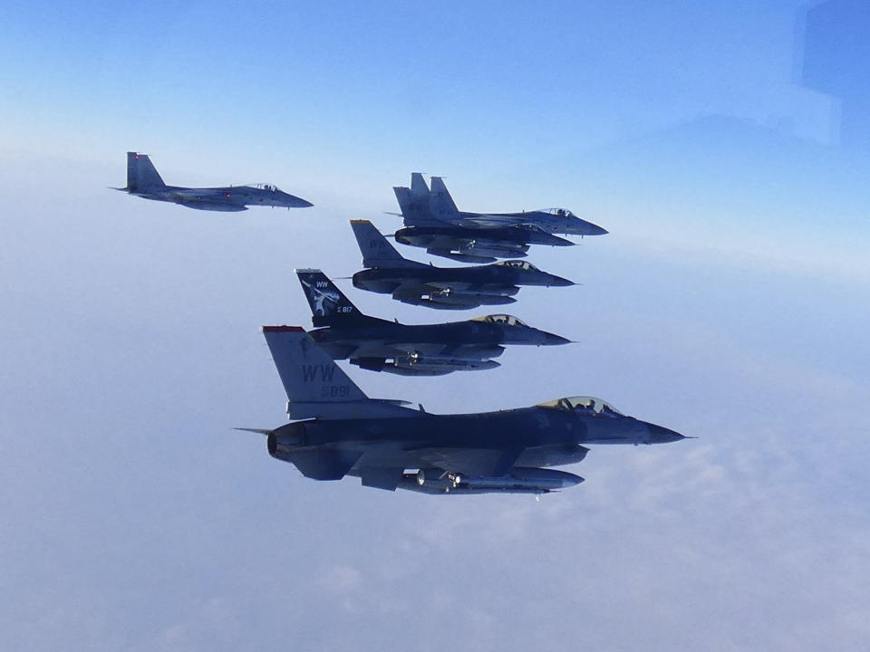 This photo released by the Joint Staff of Japanese Self-Defense Force, shows two F-15 warplanes, rear left and background, of the Japanese Self-Defense Force and four F-16 fighters of the U.S. Air Force during a bilateral exercise Sunday, Feb. 19, 2023. The United States responded by flying long-range supersonic bombers Sunday for separate joint exercises with South Korean and Japanese warplanes in a show of force against North Korea.(Joint Staff of the Japanese Self-Defense Force via AP)