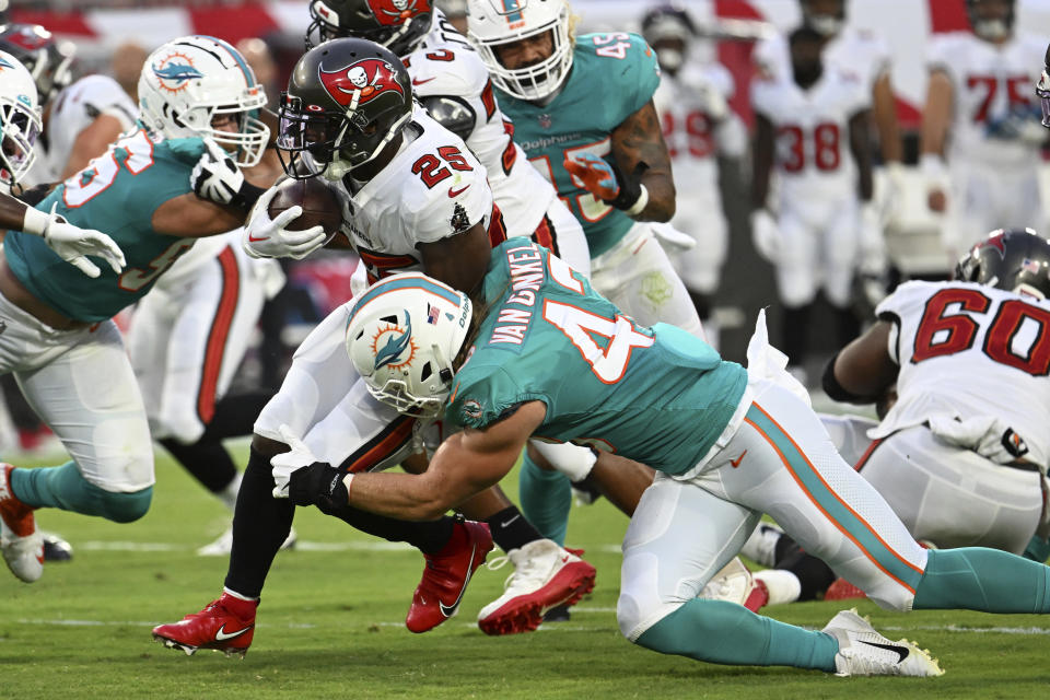 Miami Dolphins linebacker Andrew Van Ginkel (43) stops <a class="link " href="https://sports.yahoo.com/nfl/teams/tampa-bay/" data-i13n="sec:content-canvas;subsec:anchor_text;elm:context_link" data-ylk="slk:Tampa Bay Buccaneers;sec:content-canvas;subsec:anchor_text;elm:context_link;itc:0">Tampa Bay Buccaneers</a> running back Giovani Bernard (25) during the first half of an NFL preseason football game Saturday, Aug. 13, 2022, in Tampa, Fla. (AP Photo/Jason Behnken)