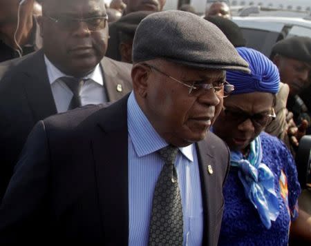 Congolese opposition leader Etienne Tshisekedi (C) is escorted upon arriving at the airport in the Democratic Republic of Congo's capital Kinshasa, July 27, 2016, after nearly two-year stay overseas for medical treatment. REUTERS/Kenny Katombe